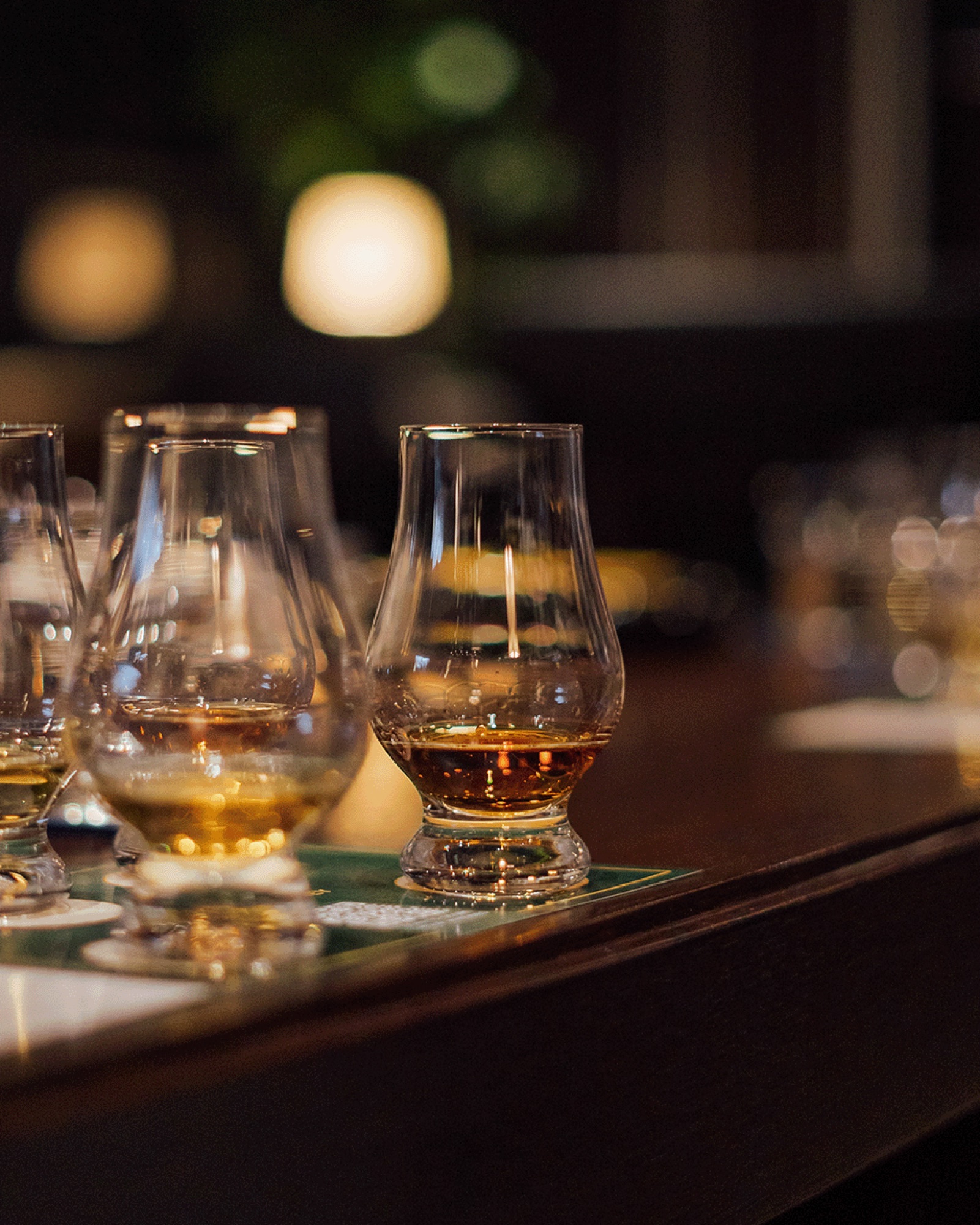 A private whisky tasting table set with nosing glasses
